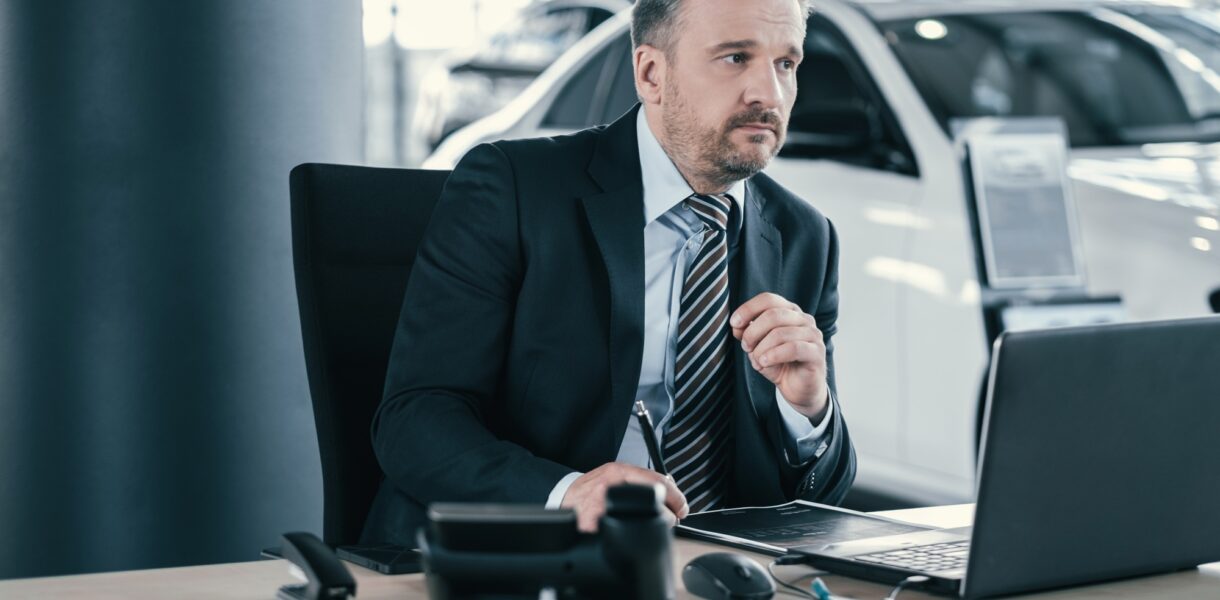 Top sales manager at dealership showroom
