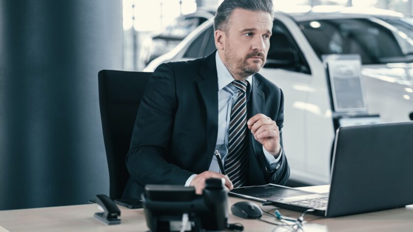 Top sales manager at dealership showroom