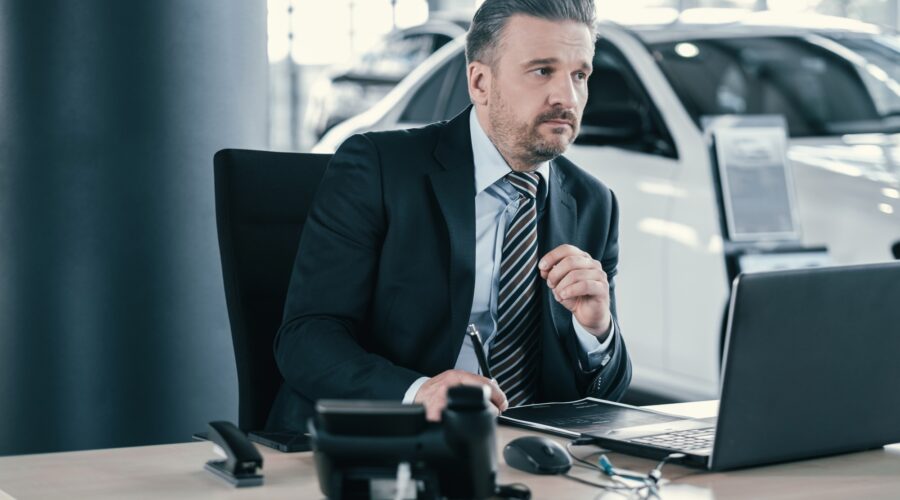 Top sales manager at dealership showroom
