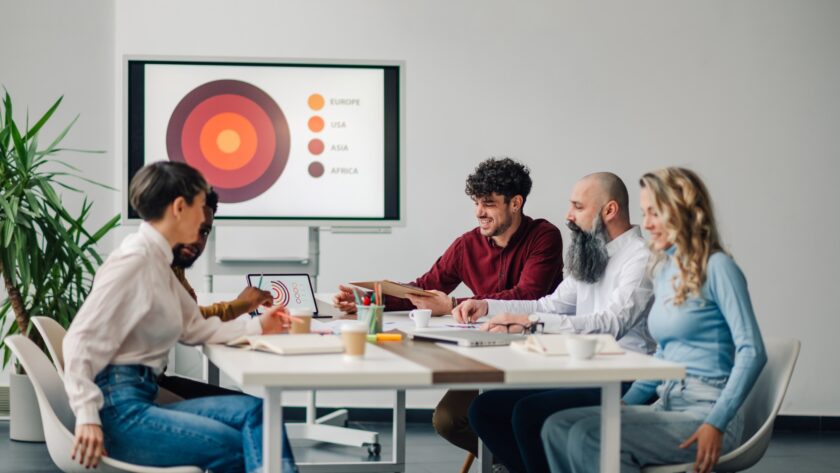 Marketing managers discussing global strategy during business meeting